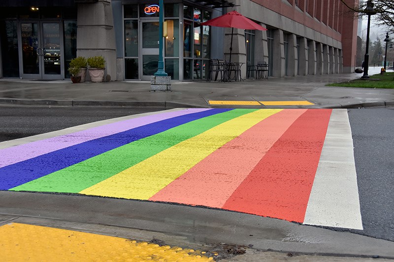 Contractors painted the city of Coquitlam’s rainbow crosswalk, next to city hall on Burlington Drive, Wednesday night.
