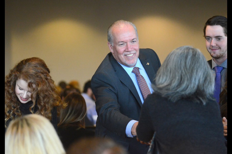 Premier John Horgan greets attendees.