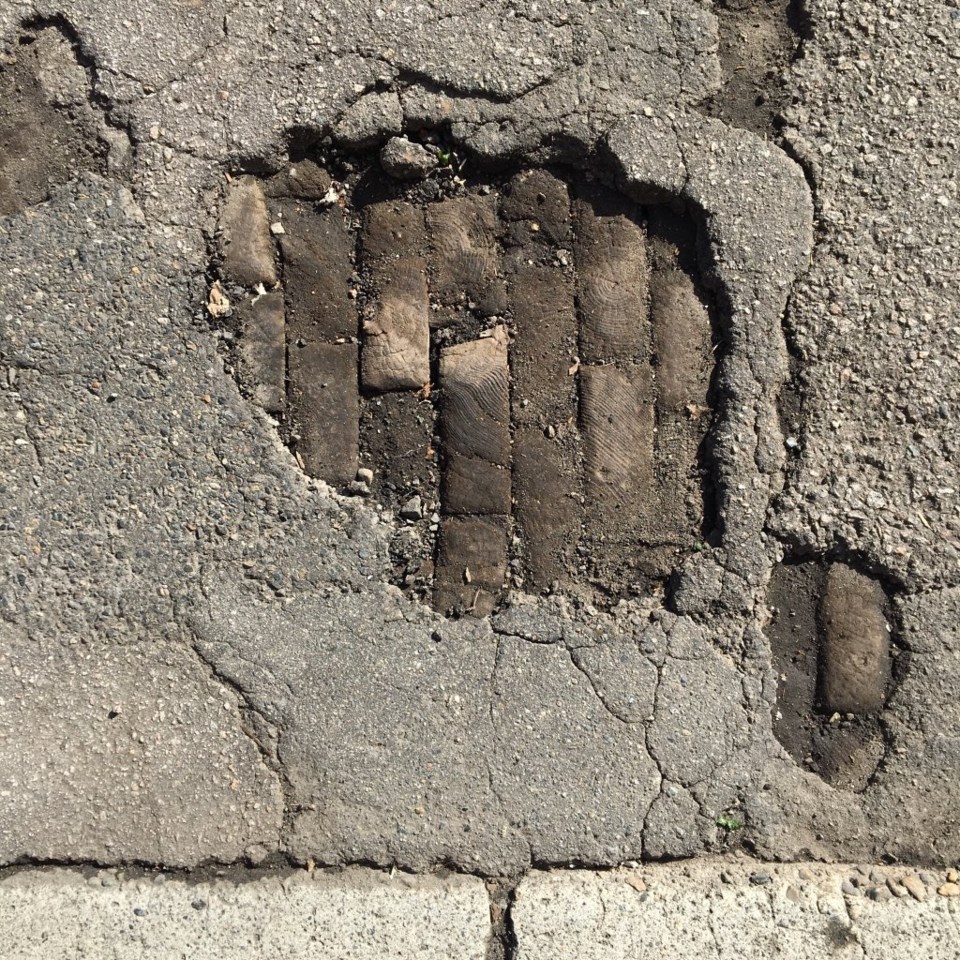 Old wooden pavers exposed on East Georgia Street. Photo Patrick Gunn, Heritage Vancouver Society