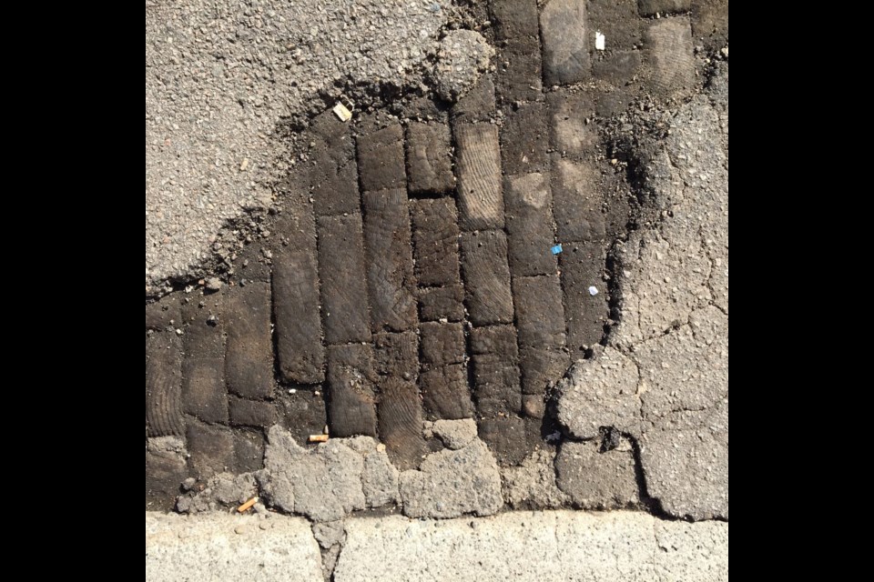 Old wooden pavers exposed on East Georgia Street, which date back more than 100 years. Photo Patrick Gunn, Heritage Vancouver Society