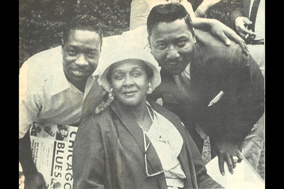 Blues musicians Otis Spann, Victoria Spivey and Muddy Waters, 1964. Spann is holding a copy of Spivey's album Chicago Blues.