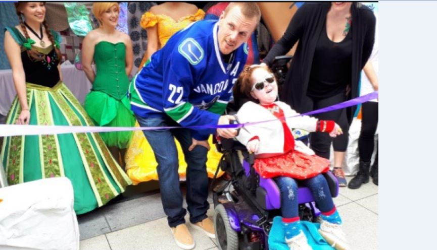 Daniel Sedin and Canuck Place Children's Hospice ambassador Charlie-Anne Cox cut the ribbon at the Best Day Ever Blanket Fort event at TELUS Garden May 13. Photo Sandra Thomas