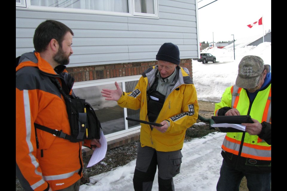 Wes Smith from Nechako Valley SAR in Vanderhoof, left, Dave Read, from the local Search and Rescue (SAR) group, and Bill Imus from Burns Lake were a team that went door-to-door to conduct a mock evacuation for training purposes that saw SAR volunteers from 10 different communities come together to share best practices information.