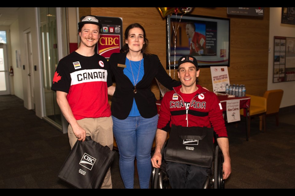 Squamish Paralympic athletes Colton Liddle (far left) and Alex Cairns (far right) celebrated their achievements with CIBC branch manager Christina Grant on Friday.