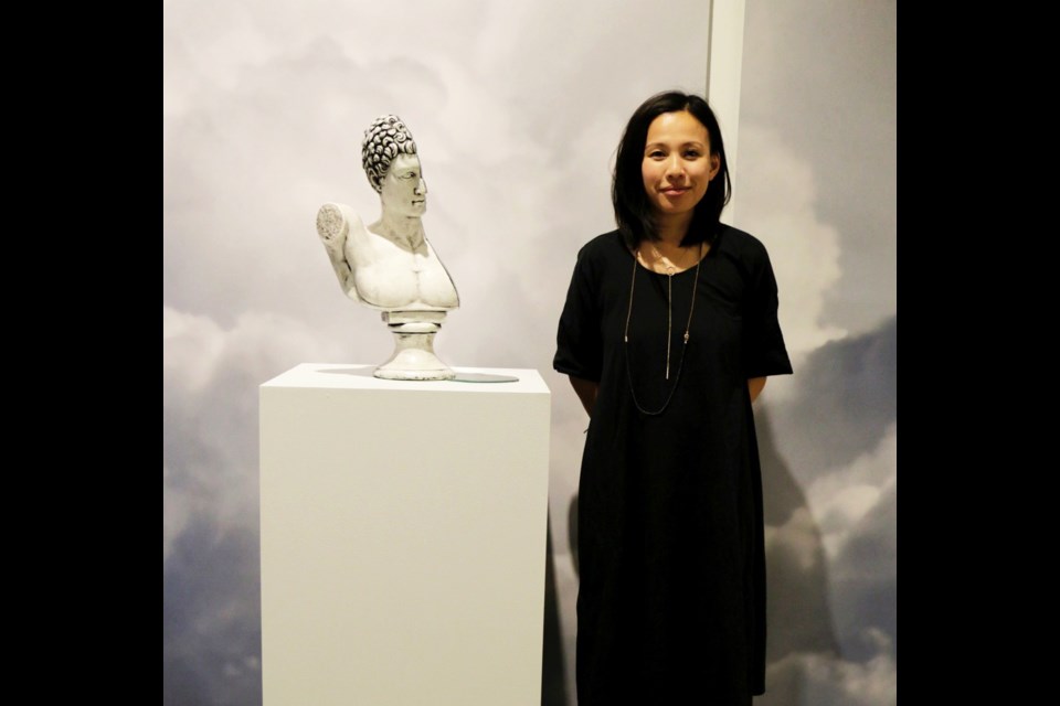 Karilynn Ming Ho with her artwork For the Left Hand Alone. Photo Credit Melanie Devoy