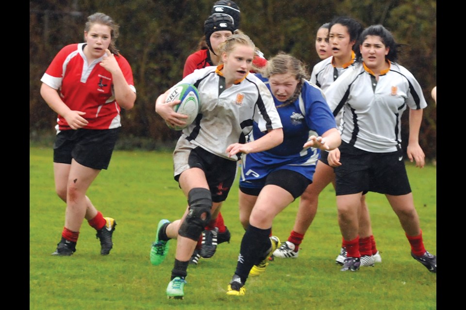 Kseniya Yakovenko of the Carson Graham senior girls rugby team charges up the field during an exhibition match against Richmond’s R.A. McMath Secondary played April 5 at the Lucas Centre field. High school girls rugby is taking off on the North Shore. photo Paul McGrath, North Shore News