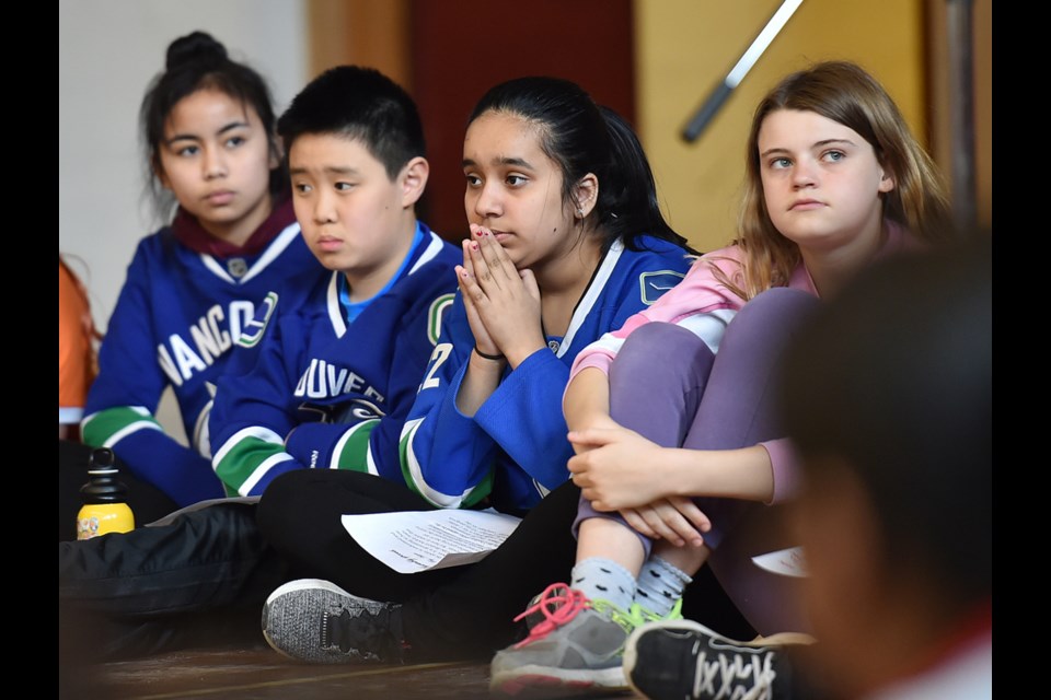 Grenfell elementary students, from left, Stephanie Sarranquin, Brydan Yuen, Aalam Khangura and Coral Heatherington spoke to the importance of empathy and compassion at an assembly Thursday that launched the school's fundraising efforts for the Humboldt Broncos hockey team.