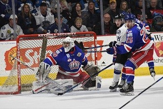 Wenatchee Wild forward Matt Dorsey loses the puck through his legs while standing in the slot while Murphy Stratton of the Wild and Spruce Kings defenceman Liam Watson-Brawn (26), forward Kyle Johnson (15) and goalie Evan DeBrouwer look on during Game 2 of the BCHL Fred Page Cup championship series Saturday in Wenatchee, Wash. The WIld won 4-2 and took a 2-0 sereis lead.