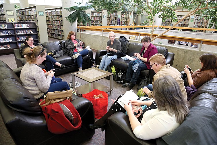 A group of needlecrafters gather at the Bob Harkins Branch of Prince George Public LIbrary on Sunday afternoon to socialize with other needlecrafters and work on their latest projects. Citizen Photo by James Doyle