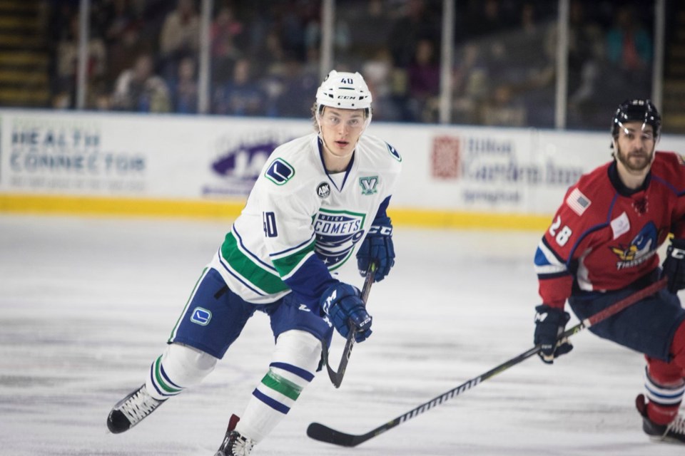 Lukas Jasek skates up ice for the Utica Comets