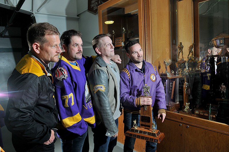 Members of the Port Coquitlam Vikings oldtimers hockey team, including Curtis Day, Rick Holman, Kevin Boerma and Cory Geill, look for space in the trophy case at the Port Coquitlam Rec Centre for their own championship chalice they won in the Pitt Meadows Old Timers Hockey Association after 20 years of trying. Most of the team is comprised of players who won provincial Peewee and Bantam championships for Port Coquitlam as kids.