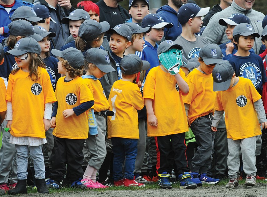 This photo from opening day of the North Shore Baseball Association appeared on the cover of the North Shore News, a joyful image standing in stark contrast to the tragic story beside it on the front page about the bus crash involving the Humboldt Broncos. photo Cindy Goodman, North Shore News