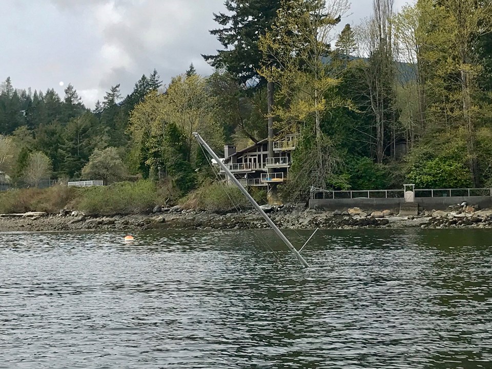 Sail mat of sunken boat in Mannion Bay