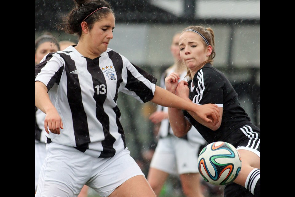 MARIO BARTEL/THE TRI-CITY NEWS
Dr. Charles Best midfielder Maya Borego battles for the ball with Gleneagle Talons defender Jordyn Harding in the first half of their Fraser Valley North BC high school girls soccer match, Monday at Coquitlam Town Centre Park. Borego scored twice in the Blue Devils' 9-0 victory. Isabel Lambert scored three times and Jenna Mele also added a pair, along with singles from Daniella Bavaro and Leah Favaro.