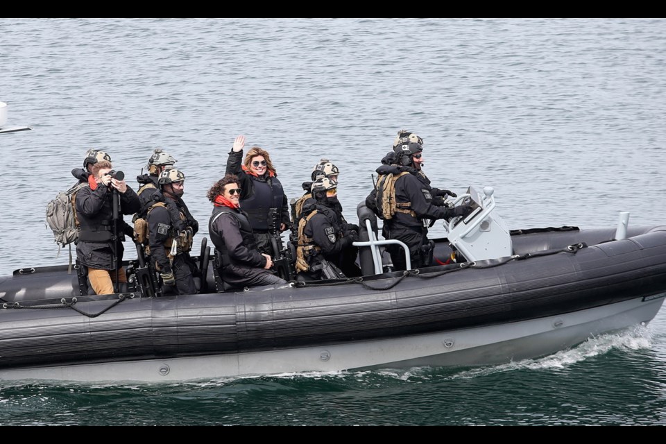 Shania Twain waves upon her arrival to HMCS Ottawa at CFB Esquimalt on Thursday, April 19, 2018.