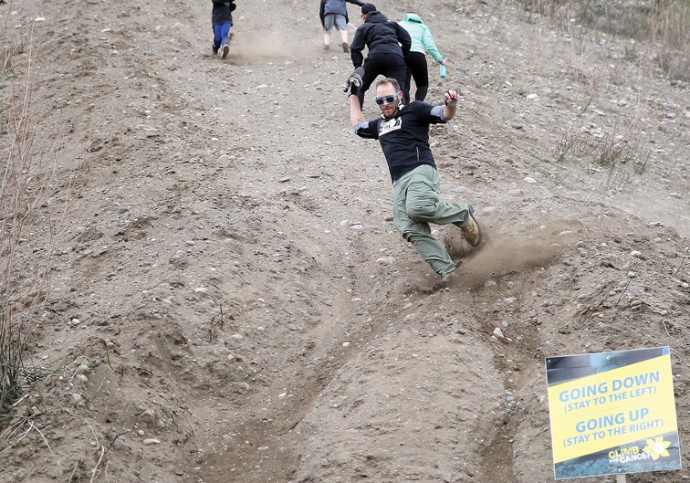 Devon Flynn races down the cutbanks on Saturday afternoon as he completes his third lap during the third annual Climb for Cancer. Funds raised from Saturday's event go to support the Kordyban Lodge in Prince George.