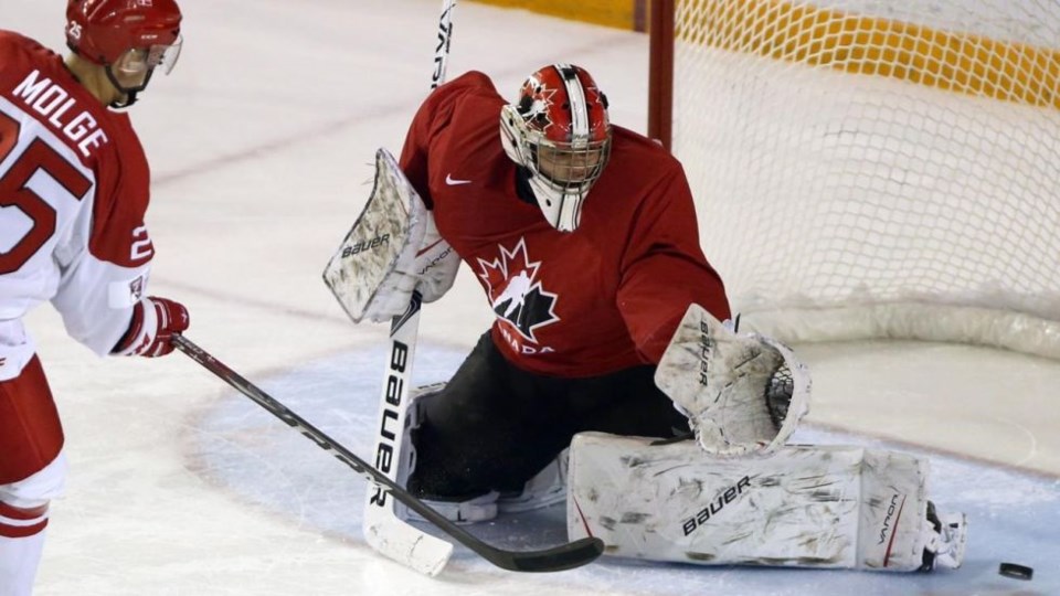 Michael DiPietro makes a save for Team Canada