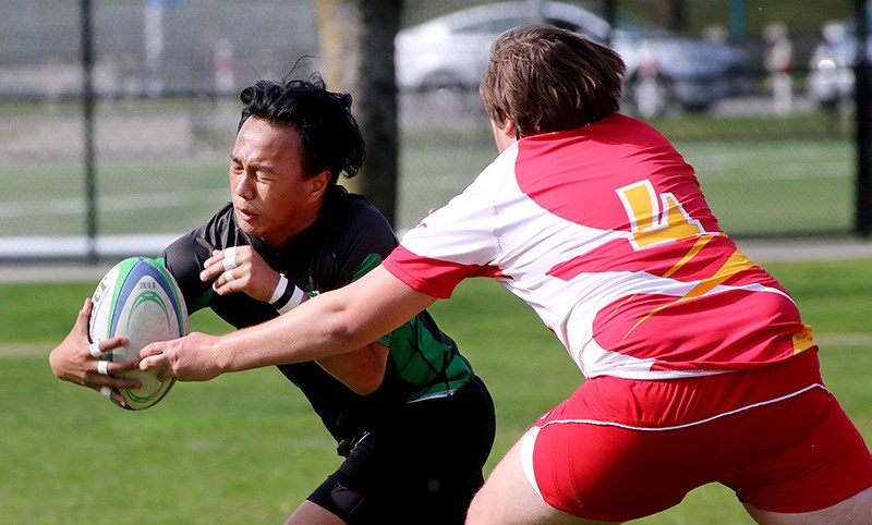 Riverside Rapids ball carrier Bienne Pablo Karlos tries to elude the grasp of a W.J. Mouat tackler in the first half of their BC high school boys Tier II rugby match, Tuesday at Riverside secondary school. The Rapids won the match 50-5 to improve their record to five wins against no losses. Ethan Kelt scored three tries for the Rapids and added five conversions, while Tristen Hendricks added a pair of tries. Single tries came from Alit At, Owen Deo and Jacob Granville.