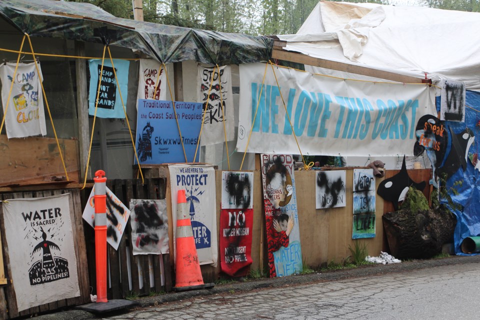 Graffiti on the main structure at Camp Cloud outside Trans Mountain's terminal on Burnaby Mountain. Residents of the camp say they woke up to find the graffiti Saturday morning (April 28).