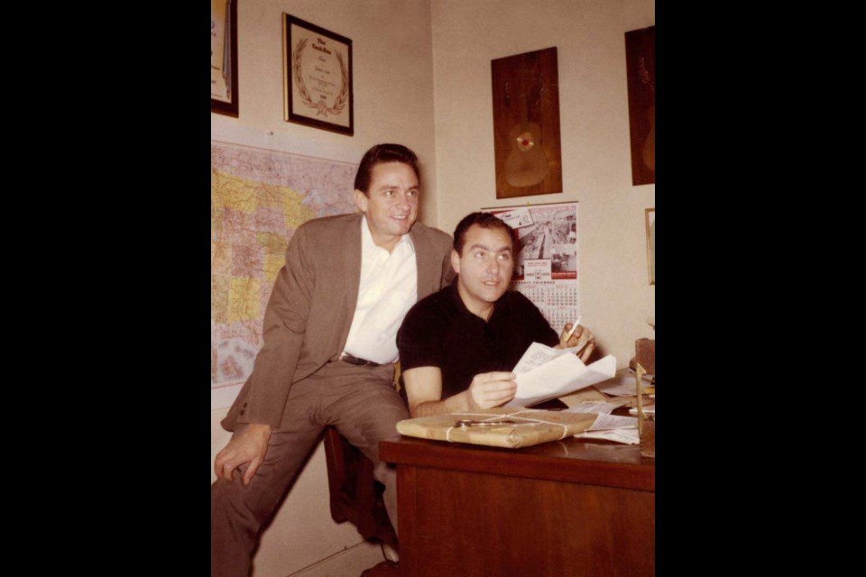 Johnny Cash and Saul Holiff in the Ventura, California-based offices of Johnny Cash Incorporated in 1961.