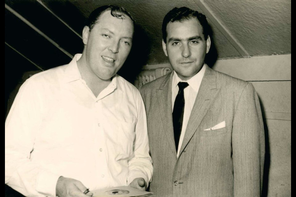 Saul Holiff stands with early rock 'n' roll pioneer Bill Haley, who he promoted extensively in the late 1950s. (London, Ontario, 1957)
