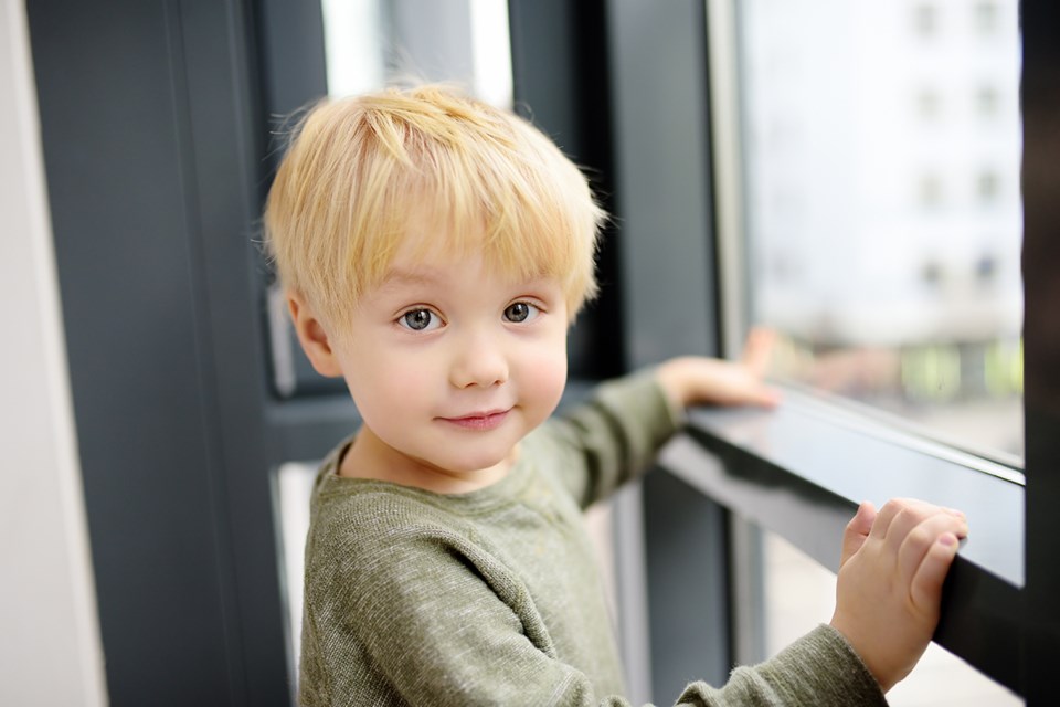 boy looking out window