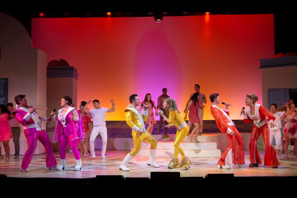 You know you can't resist singing along. The cast of Arts Club Theatre Company's Mamma Mia!, onstage at the Stanley Theatre until Aug. 12. Set design by David Roberts, costume design by Alison Green and lighting design by Robert Sondergaard.