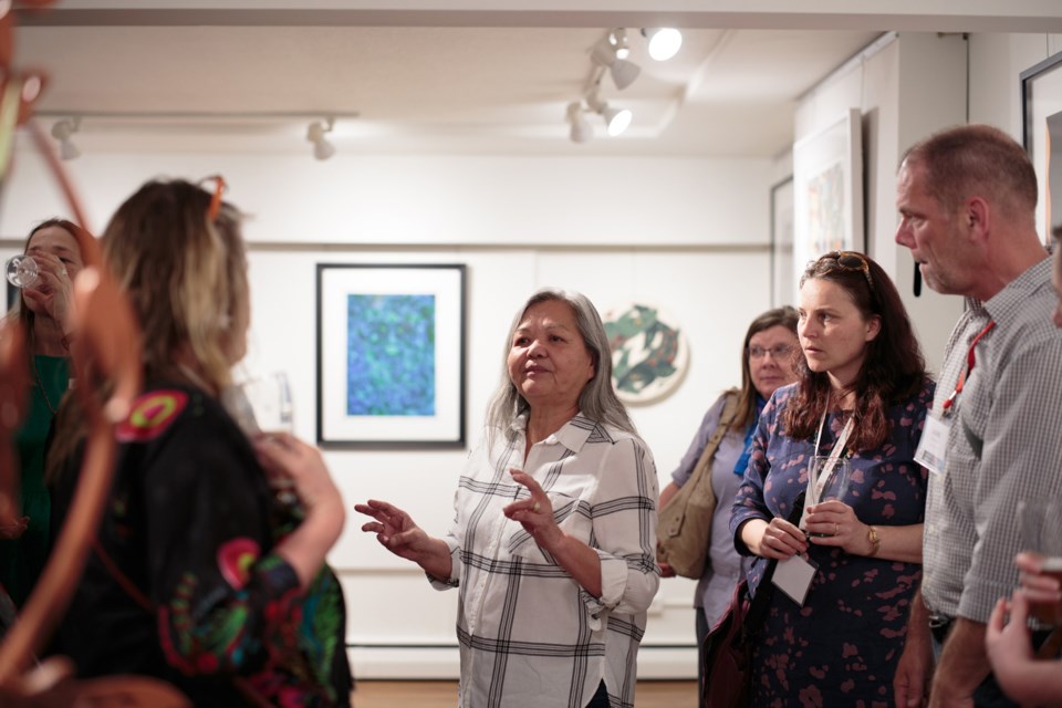 Susan Point talks to visitors at Deer Lake Gallery during the finale event of the Arts B.C. conference, held in Burnaby May 10 to 12.