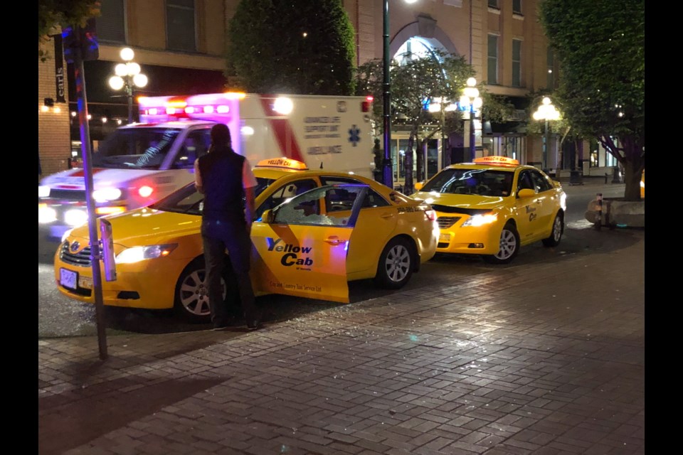 A cab was damaged by a man who attacked several people with a wooden stick on Wednesday night in downtown Victoria. (May 16, 2018)