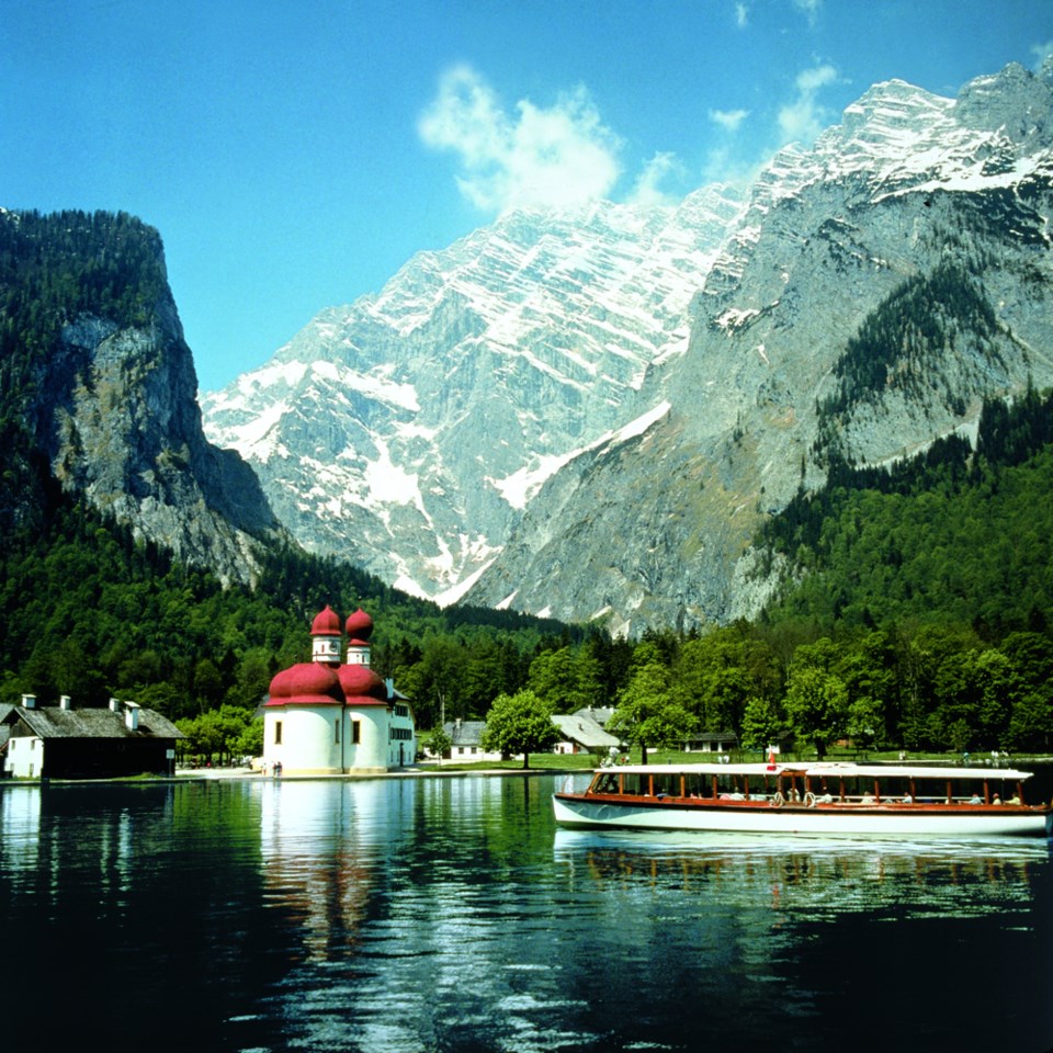 Electric-powered ferry boats silently take passengers across Bavaria’s deepest lake, weaving through