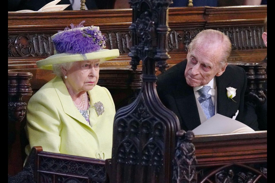 The Queen and Prince Phillip during the wedding ceremony of Prince Harry and Meghan Markle at St. George's Chapel in Windsor Castle in Windsor, near London, England, Saturday, May 19, 2018.