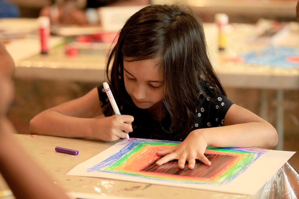 Alysa Saini creates art at the In the BAG family drop-in session on Sunday, May 20.