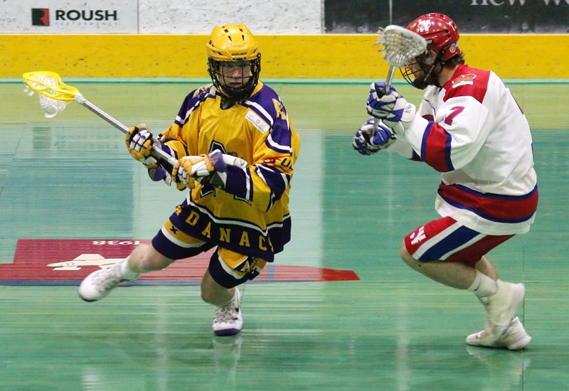 MARIO BARTEL/THE TRI-CITY NEWS
A Coquitlam Adanacs' runner tries to work his way around New Westminster Salmonbellies defender Ryan Wilkinson in the first period of their BC Junior A Lacrosse League game, Tuesday at Queen's Park Arena in New West.