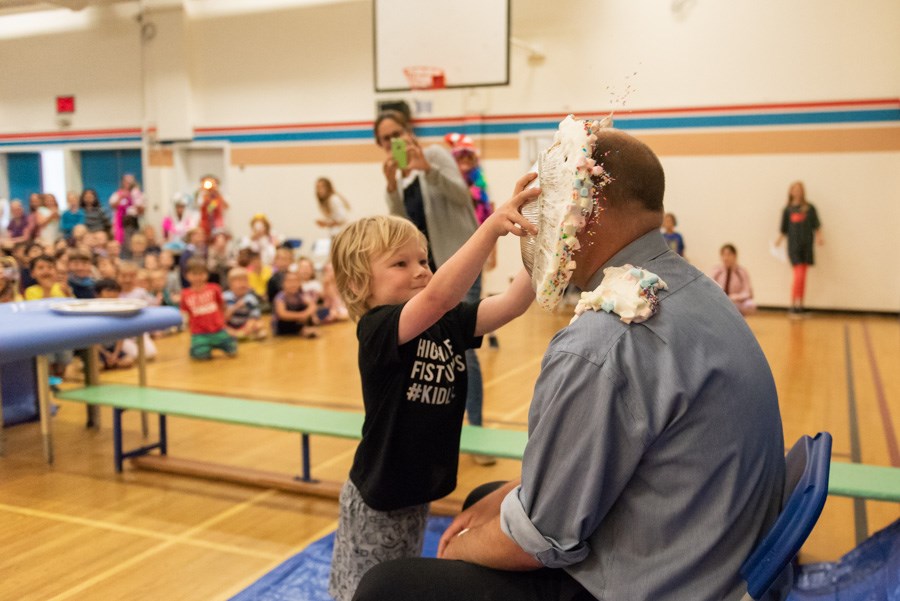 Liam Waterer, age 5, had the honour of putting a pie in his principal's face on Friday.