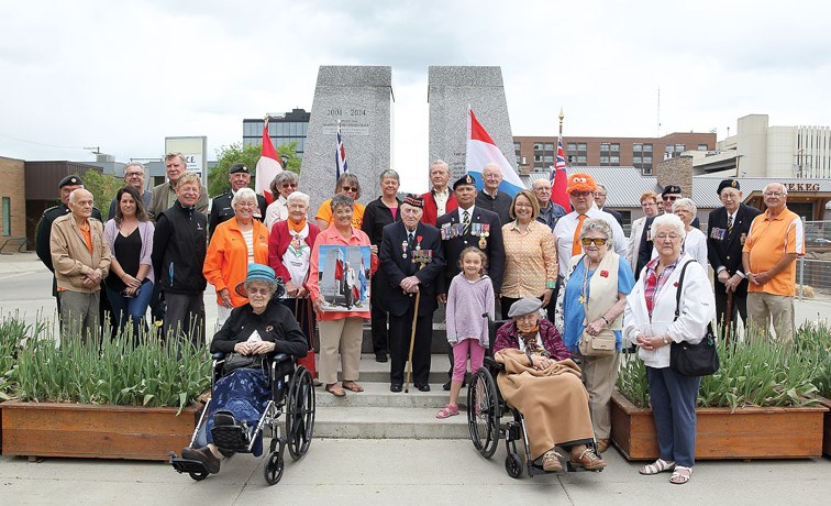 The Dutch-Canadian Tulip Commemoration ceremony was held on Saturday afternoon. Most of those who attended the event gathered for a photograph to mark the very special occasion.