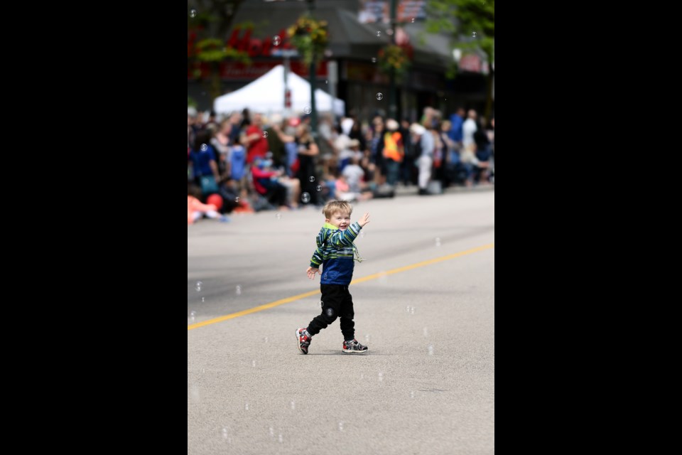 Three-year-old Lucas Zenone chases bubbles.