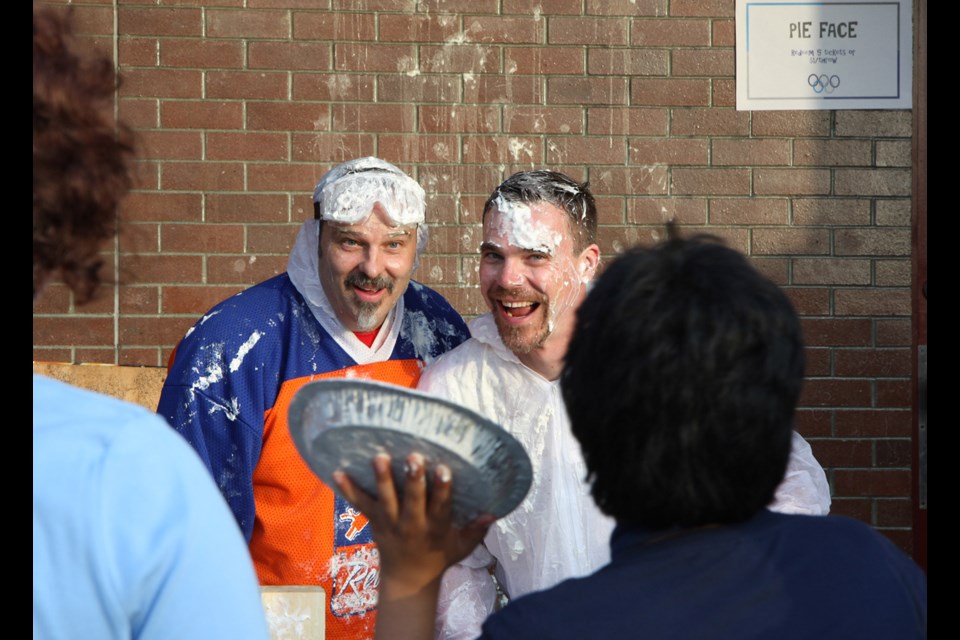 Glenbrook principal Chris Evans, left, and vice-principal Greg Patton wait to get another whipped cream pie in the face.