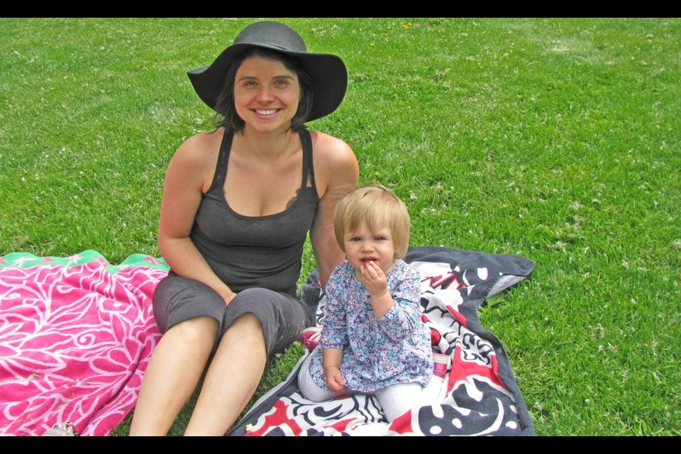 Dana Strilkiwsky, with daughter Isabella, 15 months, are getting ready for the yoga class held during National Health and Fitness Day on Saturday morning at Lheidli T'enneh Memorial Park.