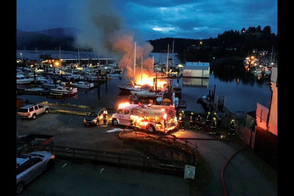 A fire engulfed a boathouse and multiple boats in Gibsons Harbour in the early hours of June 4. RCMP are still investigating the cause.