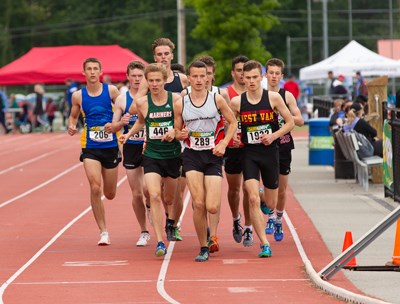Carson Graham's Cameron Bates (#289) and West Van's Aidan Doherty set the pace in the senior boys 1,500-metre final at the B.C. High School Track and Field Championships held last weekend in Langley. Doherty finished first with Bates just behind in second place. photo Mark Bates Photography