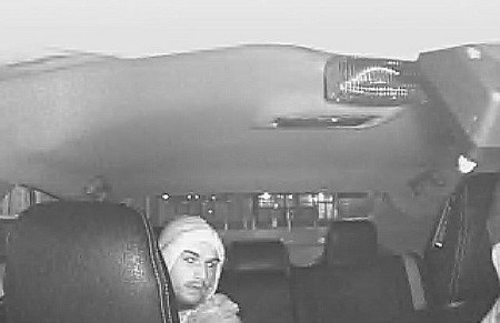 Police are looking for a man suspected of robbing a cabbie at gunpoint in Burnaby last month.