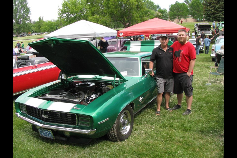 Simon, left, and son, Sean Dengel, stand beside Simon's 1969 Camaro SS Simon restored and then hot rodded for a very special reason. Their cars were among more than 360 who took part in the 44th annual Cruisin' Classics Show 'n' Shine held at Lheidli T'enneh Memorial Park Sunday.