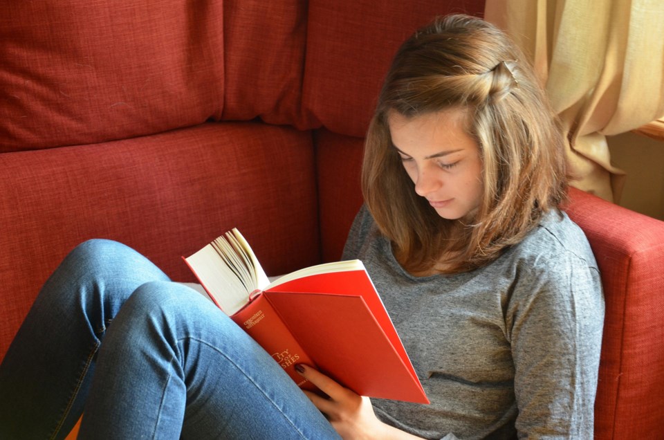teenager reading, stock photo