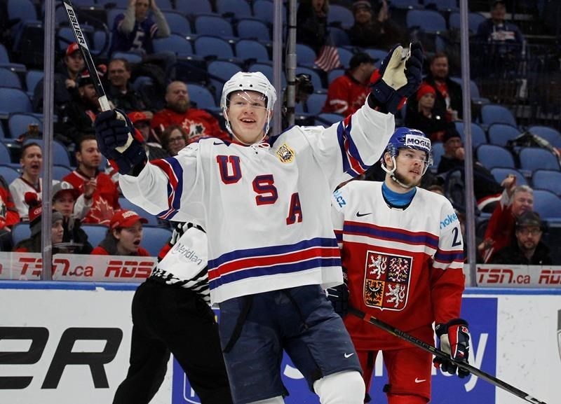 Brady Tkachuk celebrates a goal with Team USA.