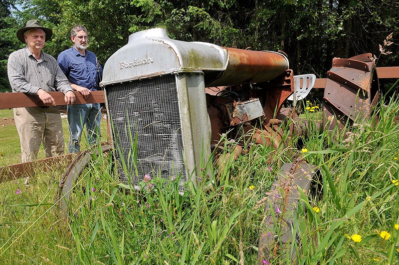 Jim Millar, the executive director of Port Moody's Station Museum, and Dave Ritcey, the president of the Port Moody Heritage Society, check out the old 1920 Fordson tractor on display in a field adjacent of Anmore's village hall.