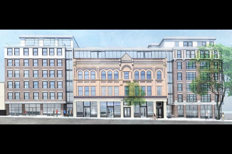 Artist’s rendering of the Duck’s Building, 1316 Broad St., flanked by two proposed condo buildings. UVic inherited the Duck’s Building in 2000 from local businessman Michael Williams. The university wants to use the site for housing.