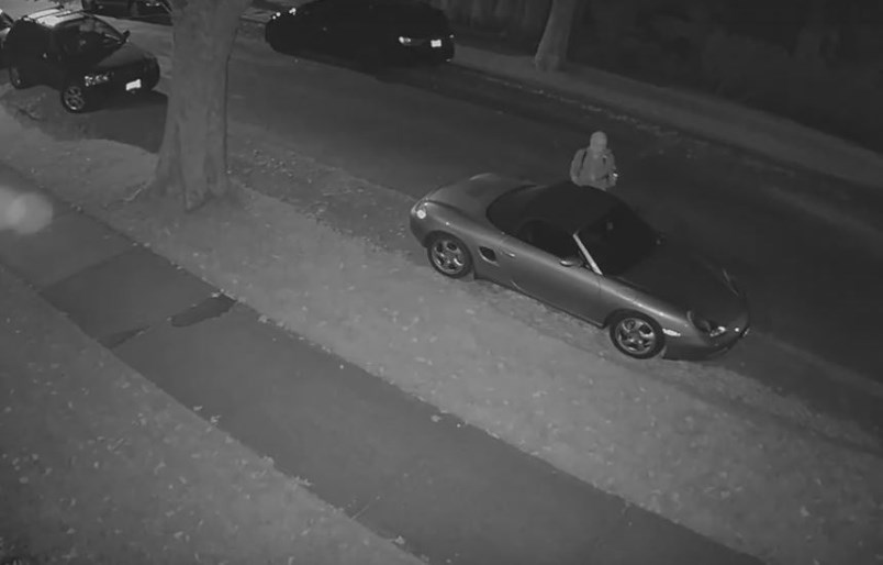 Security camera footage released by the VPD shows someone damaging a parked car on West 12th Avenue and MacDonald Street in the early morning hours of July 2.
