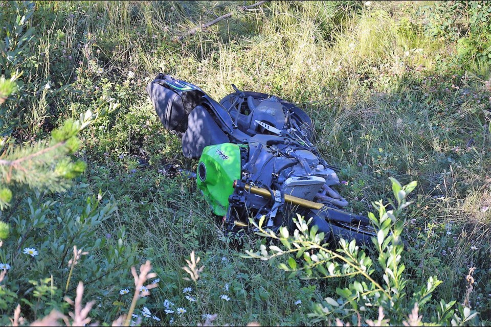 Police are searching for the rider of this motorcycle after he fled the scene, leaving his passenger behind.
