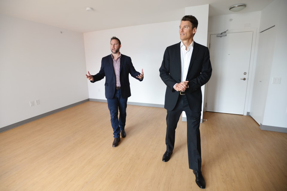 Mayor Gregor Robertson (right) checks out one of the units in Belcourt Residence. Photo Jennifer Gau