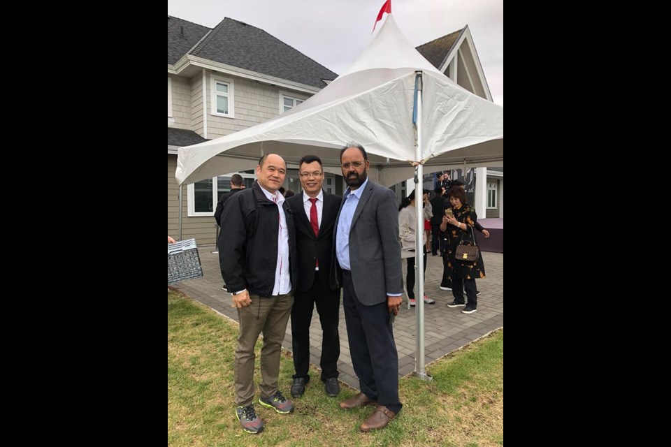 Peter Liu (middle) seen in a photo posted to Facebook labelled as "Farmland Owners Association BBQ" with Richmond realtors Chris Chan (left) and Gurdial Dale Badh (right). While some questioned Liu's possible presence at the BBQ, Coun. Bill McNulty said Liu was at another event at the same site. Photo: Chris Chan/Facebook